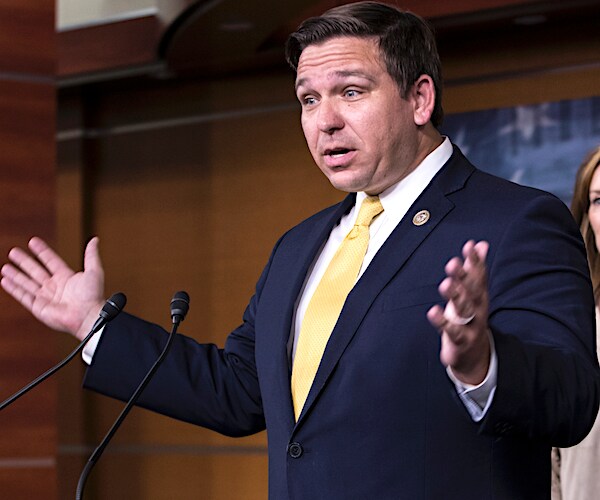 ron desantis exults in disbelief during a news conference