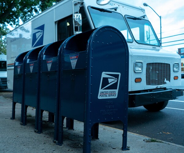 a row of mailboxes on a sidewalk