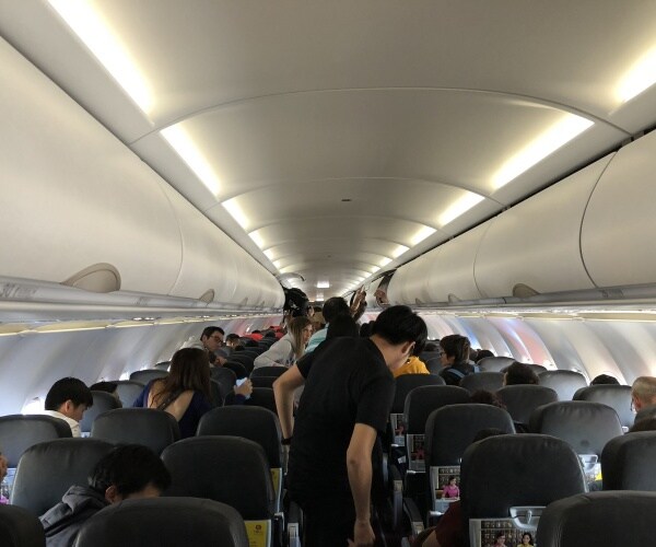 Interior of airplane with passengers
