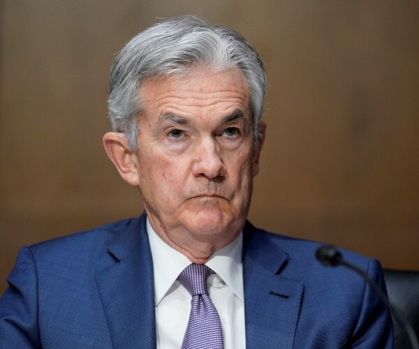 Federal Reserve Chairman Jerome Powell listens during a Senate Banking Committee hearing 