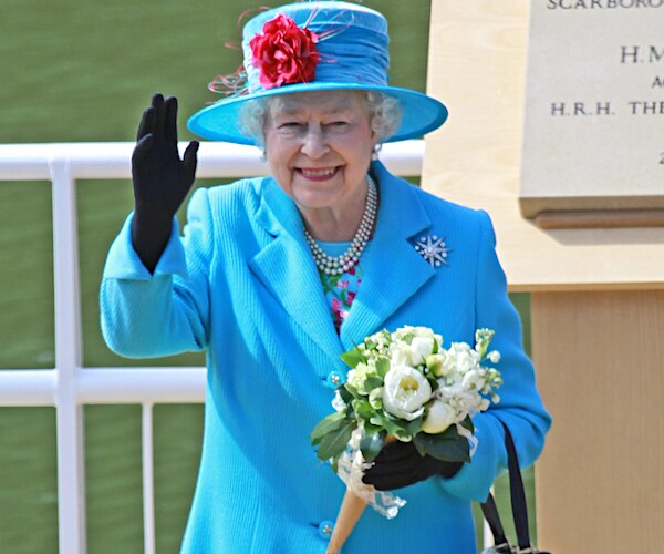 queen elizabeth II waves and smiles in her sunday go to meetings