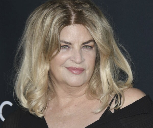 Kirstie Alley is shown in a back dress 