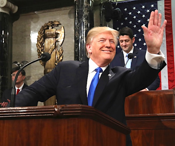 president waves before delivering his 2018 state of the union address as house speaker paul ryan applauds behind him