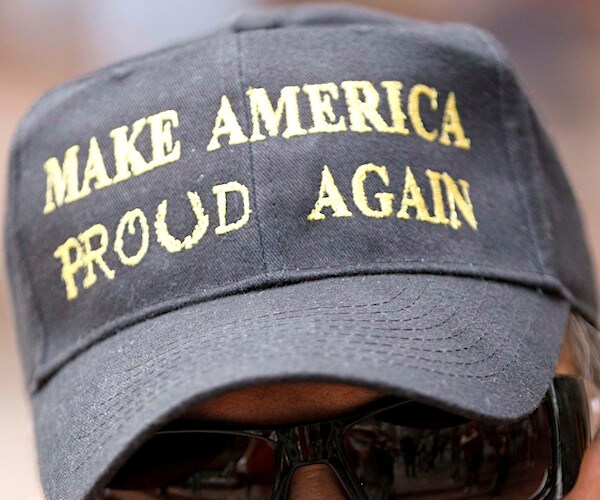 a proud boys hat reads make america proud again