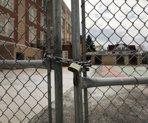 gates are locked in the courtyard of a public school