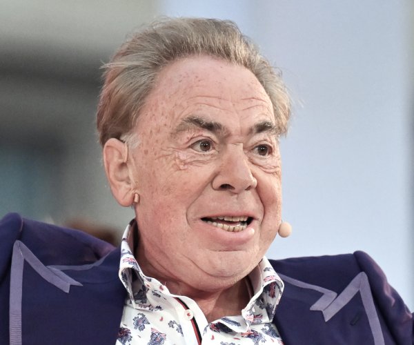 Andrew Lloyd Webber looks on