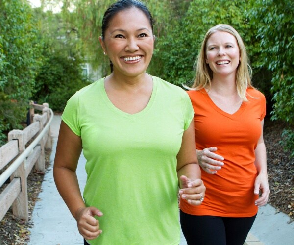 women outside walking together