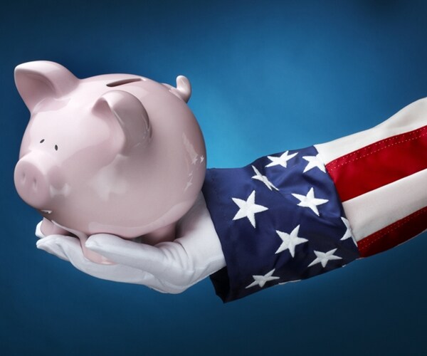 close up shot of uncle sam holding pink piggy bank

