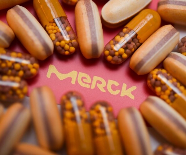 pills placed around the merck logo