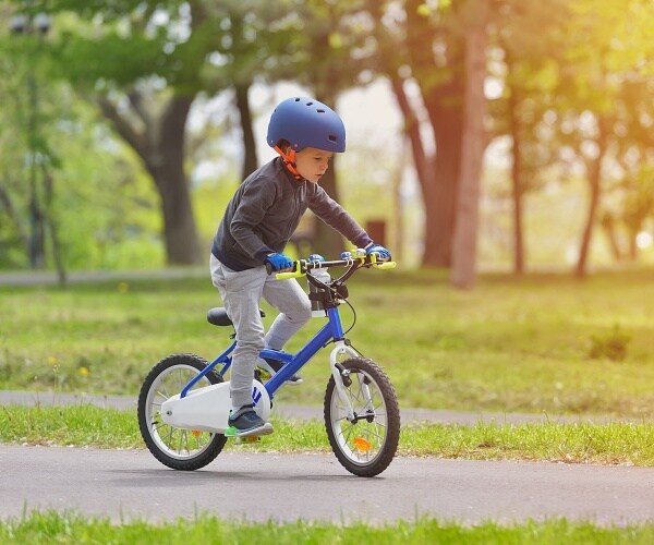 young boy riding bike