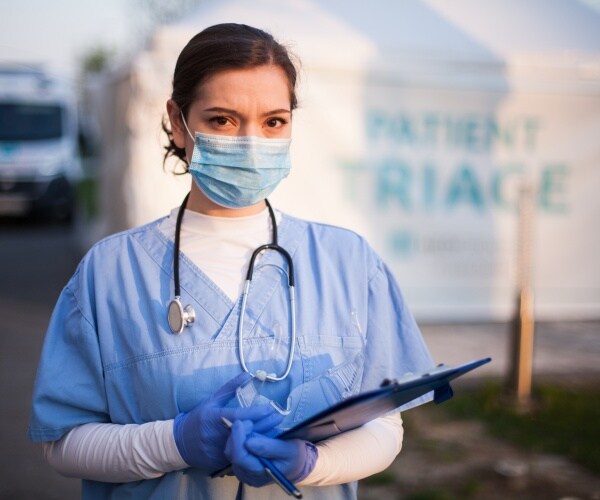 healthcare worker working triage at hospital