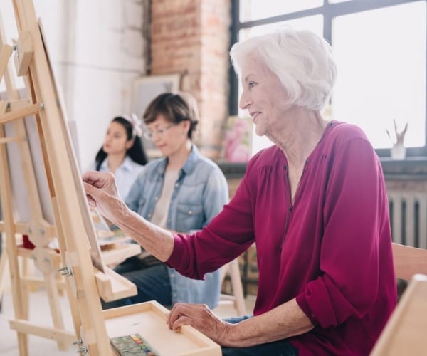 older women in a painting class