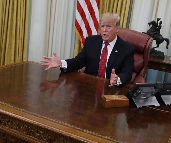 president trump speaks from the resolute desk in the oval office