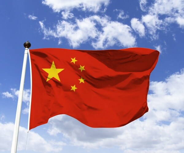 Chinese flag blowing in the wind