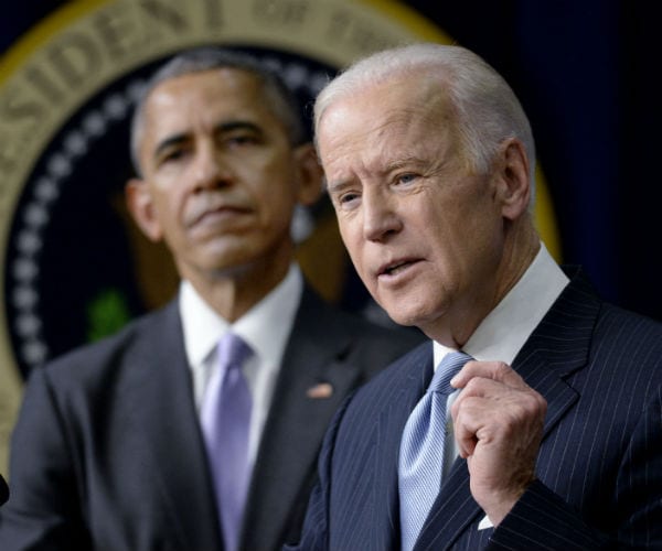 joe biden is shown speaking as president barack obama looks on 