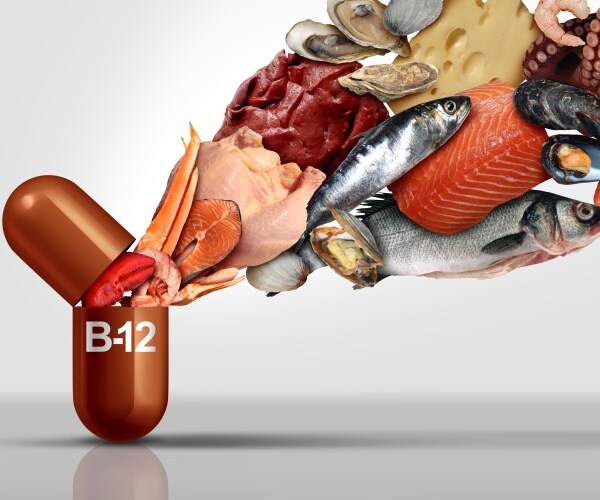 a capsule labeled 'vitamin B12' open with foods rich in vitamin B12 coming out of it