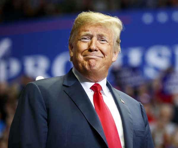 president donald trump looks to the cheering crowd as he arrives to speak at a rally in indiana. 