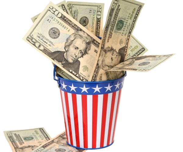 twenty-dollar bills stuffed into stars-and-stripes decorated pail american money going to government in taxes