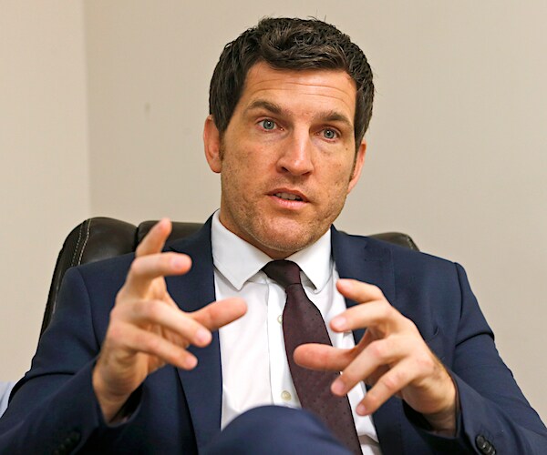 virginia republican representative scott taylor speaks with his hands while seated during an interview