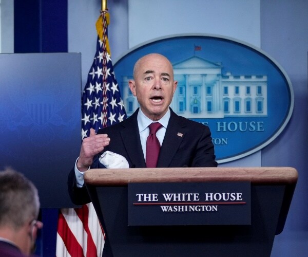 alejandro mayorkas stands at the podium and speaks in the white house briefing room