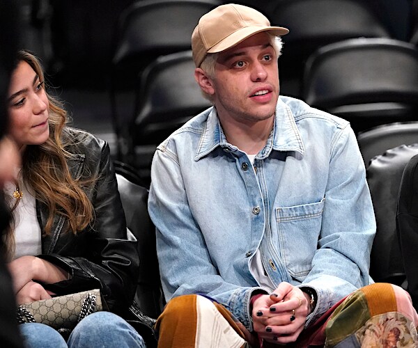 pete davidson sits and takes in an nba game