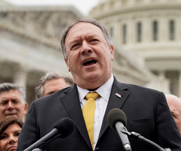 mike pompeo speaks into mic outside capitol