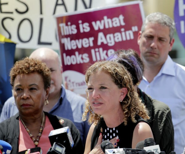 Rep. Debbie Wasserman speaks during a news conference with Rep. Barbara Lee to her left.