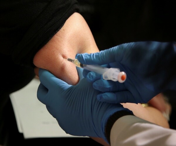 woman receiving the MMR vaccine