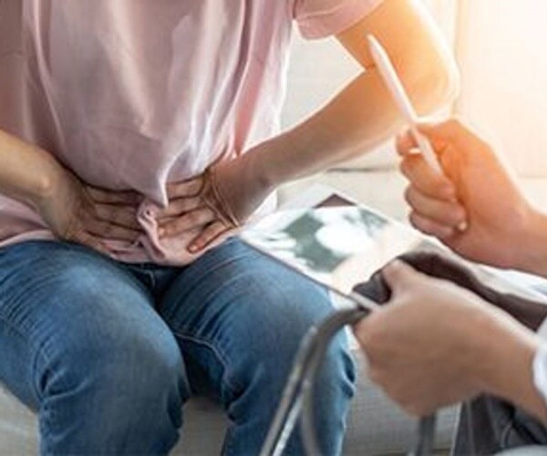 doctor talking to patient about irritable bowel symptoms