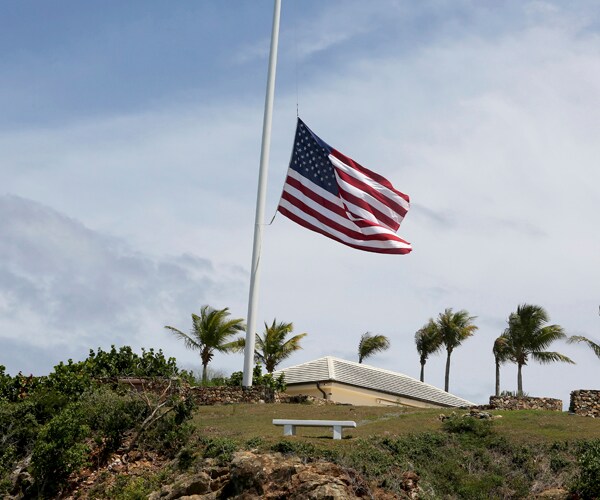 A U.S. flag at half-staff on Little St. James Island