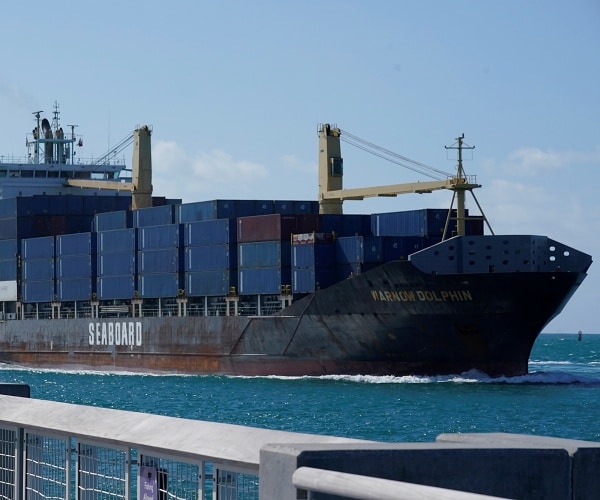 container ship sails into port