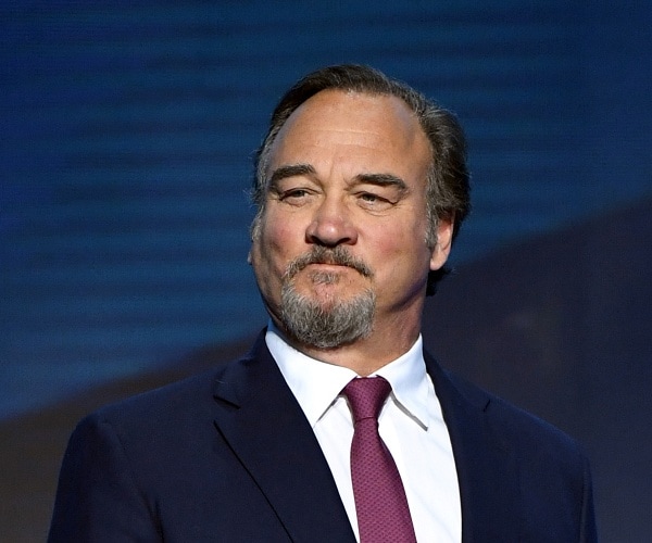 jim belushi stands onstage