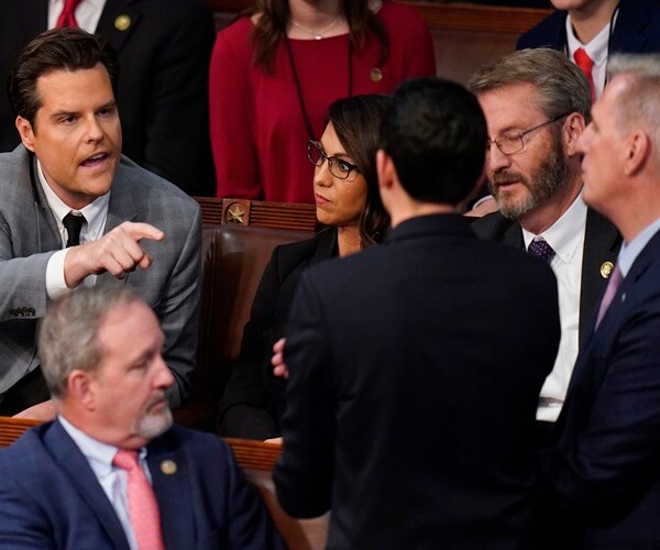 Matt Gaetz talks to Kevin McCarthy in the House chamber