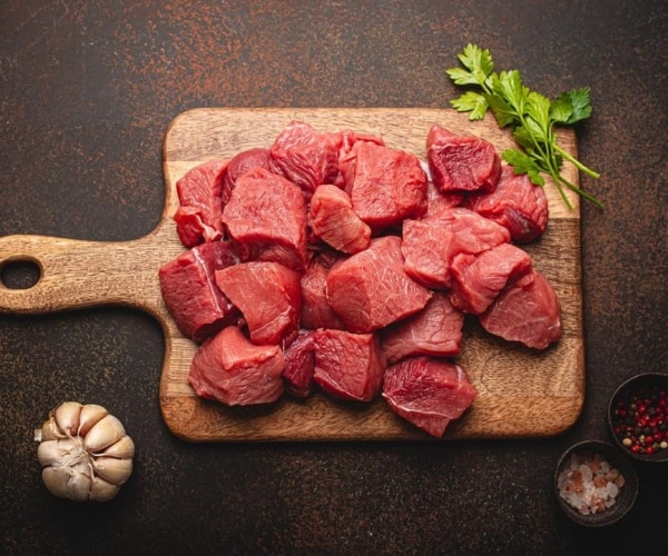 raw beef on a cutting board