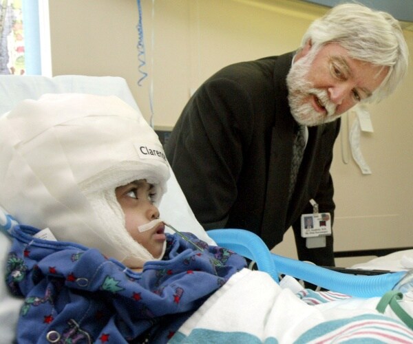 Neurosurgeon James Goodrich visits formerly conjoined twins 