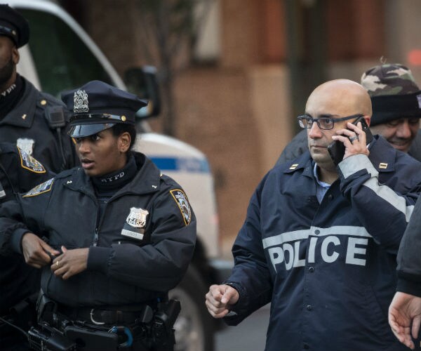 nypd officers gather near a scene where another bomb package was found