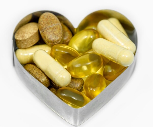 supplements in a heart-shaped cookie cutter