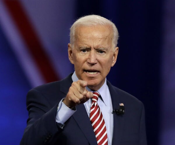 joe biden points his finger as he makes a point while speaking 