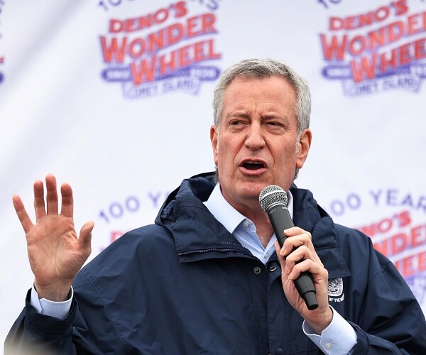 bill de blasio speaks into mic outside