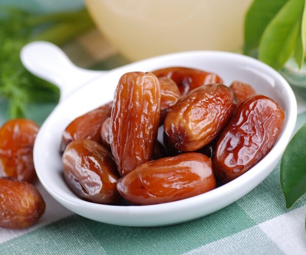 dates in a small, white dish