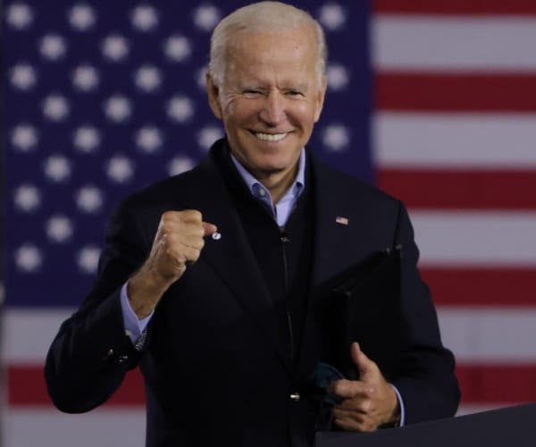 joe biden on stage at campaign event