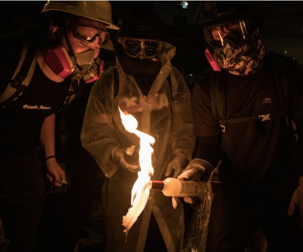 Hong Kong Protesters Set Fires in 13th Weekend of Protests