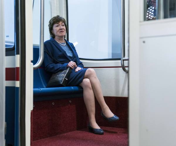 susan collins sitting in the senate subway