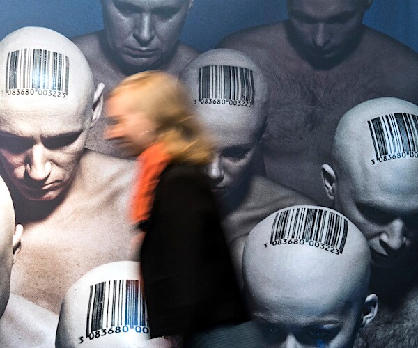 an artistic rendition of men with shaved heads and bar codes printed on top of them to represent a census