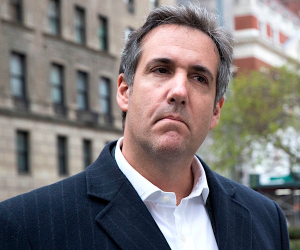 michael cohen tilts his head to his left and frowns