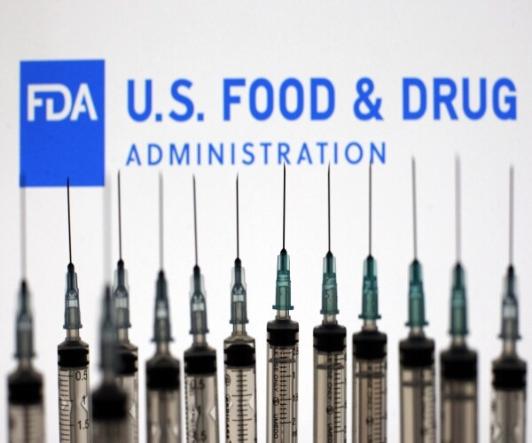 photo of syringes with FDA logo in background