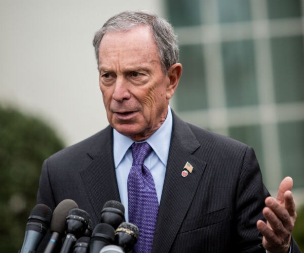 mike bloomberg is shown doing a news conference