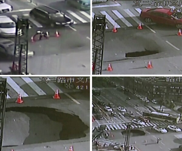 Traffic Cop Saves Chinese Drivers From Yawning Sinkhole in Road