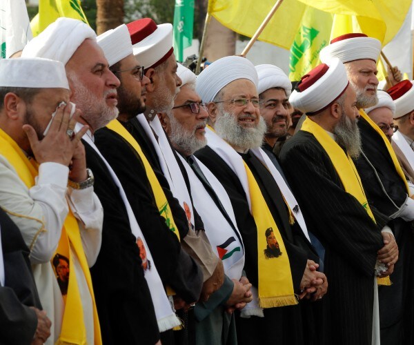 clerics of middle eastern countries partaking in a demonstration 