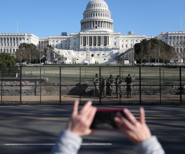 a fence is erected around the capitol.